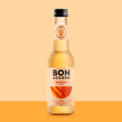 Bottle of Bon Accord Ginger Beer against bright orange backdrop