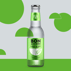 Bottle of Bon Accord Light and Dry tonic water against bright green backdrop